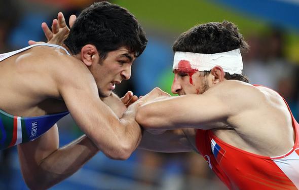 تصاویر : سومین طلای المپیک ایران با شاهکار یزدانی