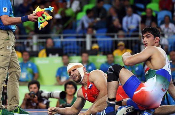 تصاویر : سومین طلای المپیک ایران با شاهکار یزدانی