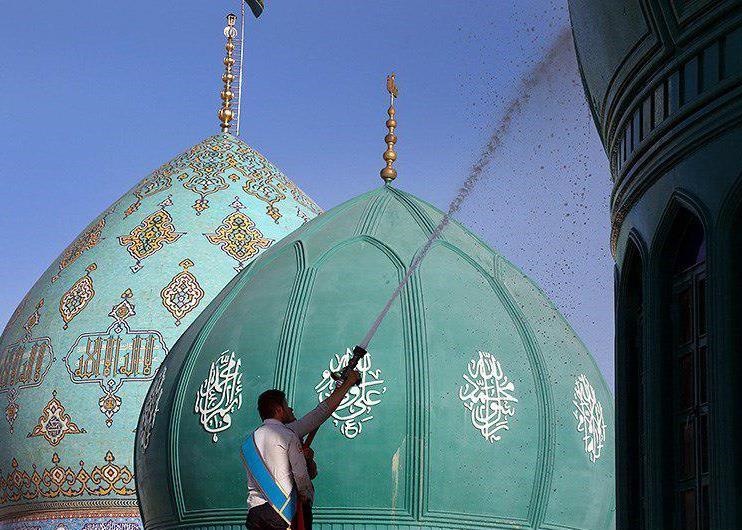 عکس / شستشو و تعویض پرچم‎ گنبد مسجد جمکران