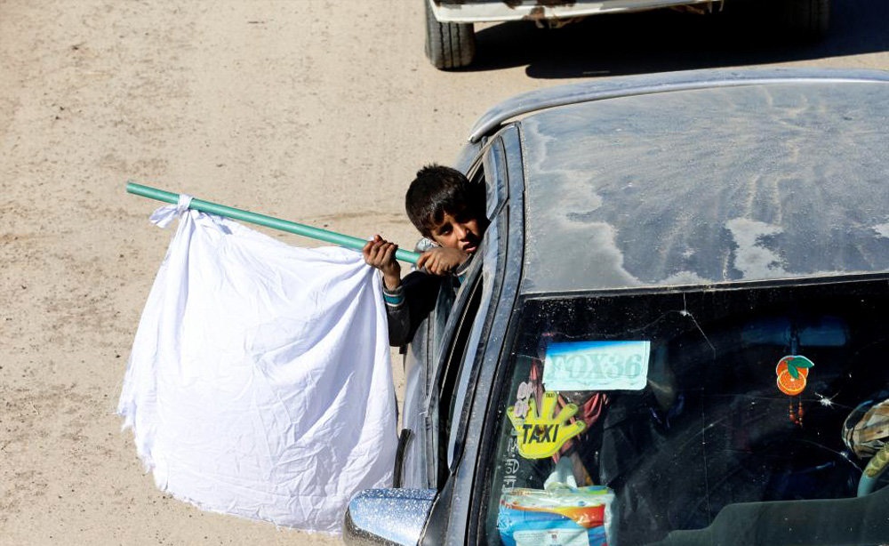 تصاویر : فرار از موصل با پرچم سفید