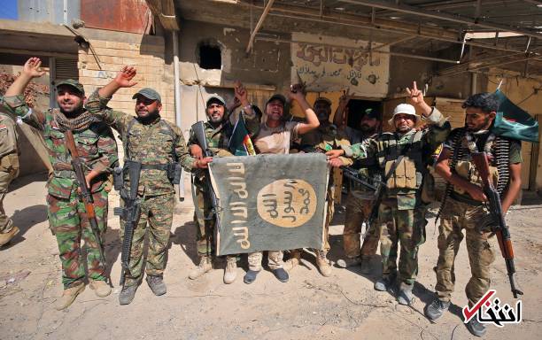 عکس/ پایین کشیدن پرچم‌های داعش در تلعفر