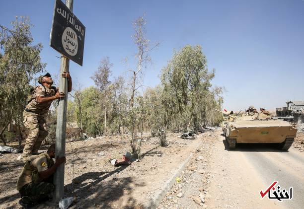 عکس/ پایین کشیدن پرچم‌های داعش در تلعفر