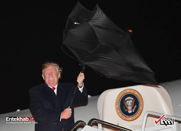 عکس/ وقتی باد چتر ترامپ را 