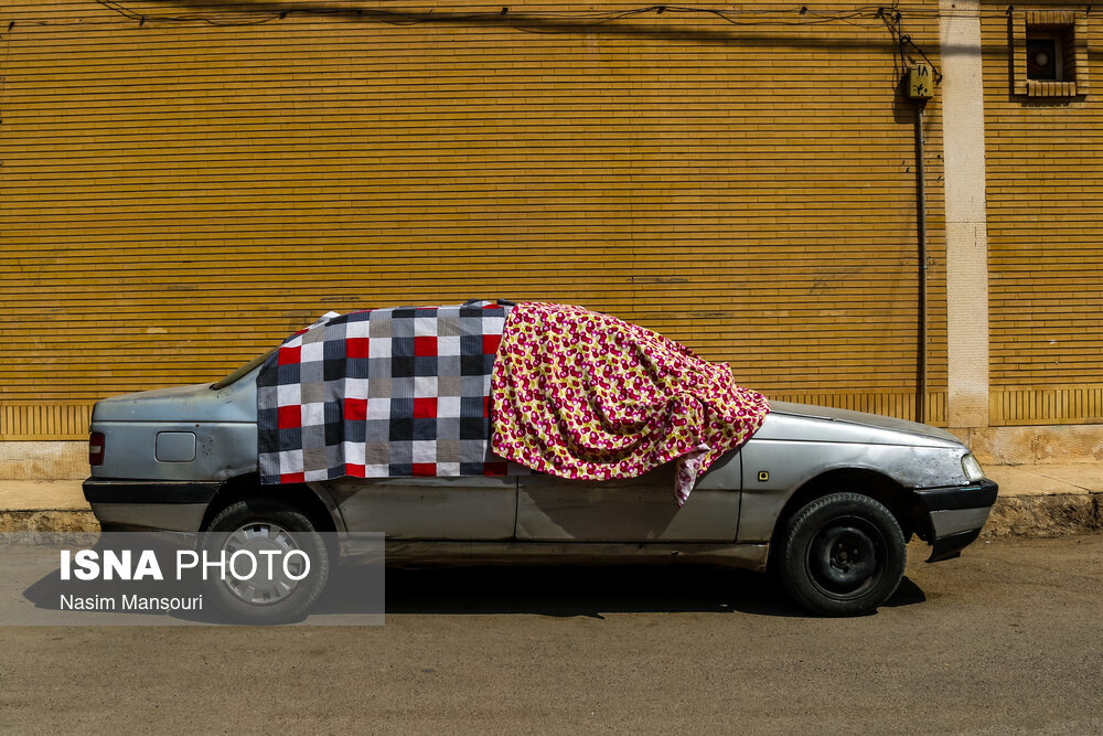 تصاویر: روپوش خودروها در گرمای خوزستان